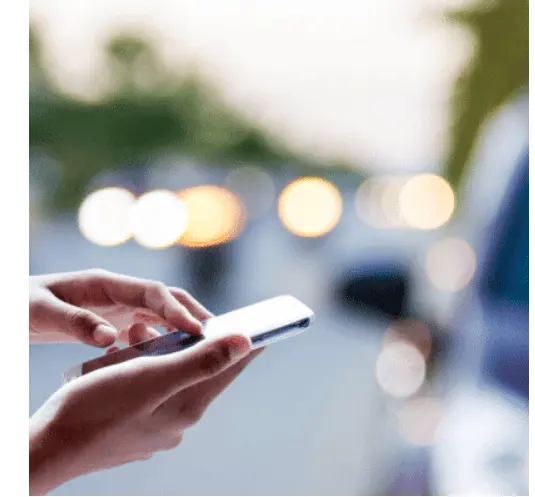 Free car removal in Melbourne customer using a mobile phone to book car pickup service