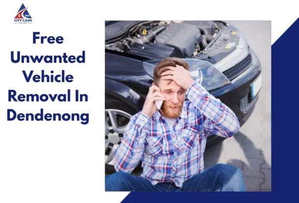 Man sitting beside a broken car while talking on the phone, promoting free unwanted vehicle removal services in Dandenong.