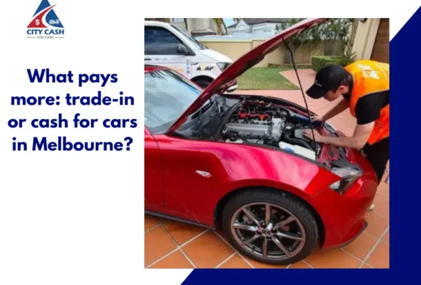 Technician inspecting a red car engine while comparing trade-in and cash for cars options in Melbourne.